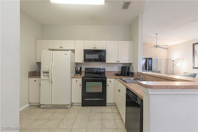 kitchen featuring white cabinetry, kitchen peninsula, black appliances, and sink