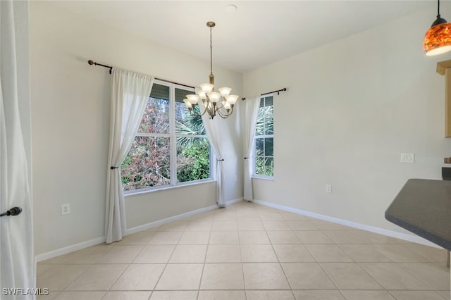 unfurnished dining area featuring a chandelier and light tile patterned floors