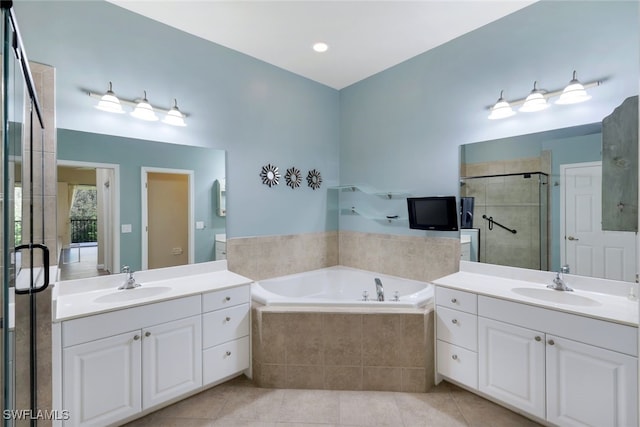 bathroom featuring vanity, tile patterned floors, and shower with separate bathtub