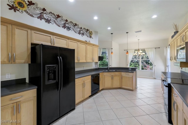 kitchen with black appliances, decorative light fixtures, an inviting chandelier, sink, and kitchen peninsula