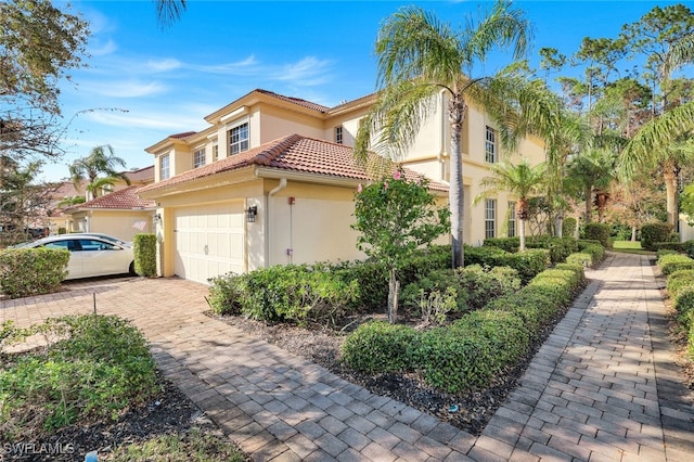 view of property exterior featuring a garage