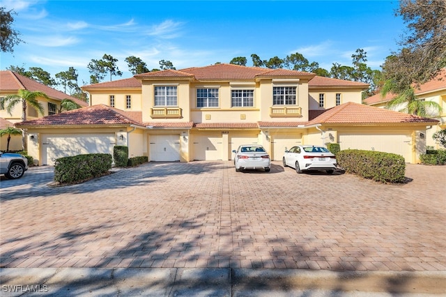 mediterranean / spanish-style home featuring a garage