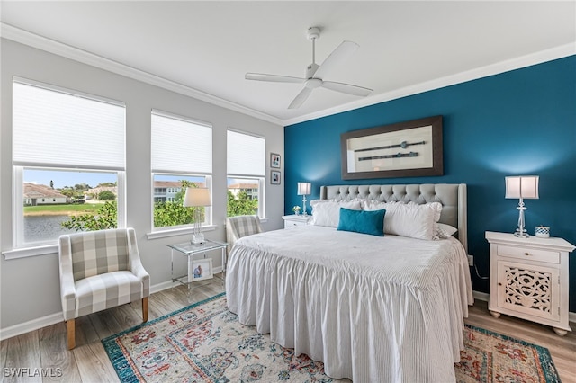 4705 Arboretum Cir Unit 202, Naples, FL 34112 - bedroom with ornamental molding, wood finished floors, and a ceiling fan