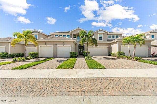 4705 Arboretum Cir Unit 202, Naples, FL 34112 - multi unit property with driveway, stucco siding, and a garage