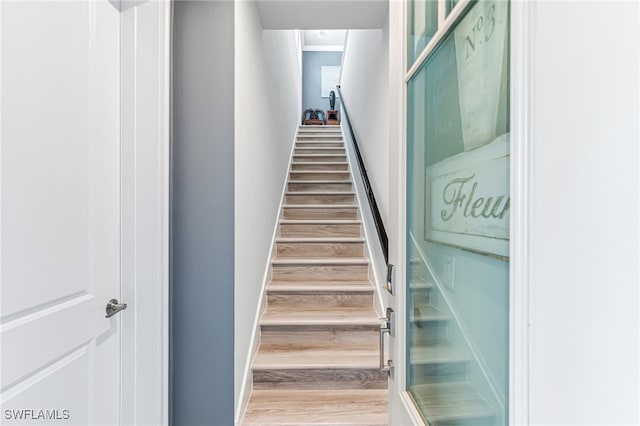 4705 Arboretum Cir Unit 202, Naples, FL 34112 - stairway featuring wood finished floors and baseboards