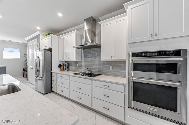 4705 Arboretum Cir Unit 202, Naples, FL 34112 - kitchen featuring stainless steel appliances, wall chimney range hood, crown molding, white cabinets, and light marble finish flooring