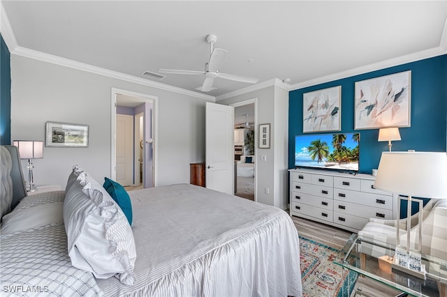 bedroom featuring ceiling fan, light wood-type flooring, and crown molding