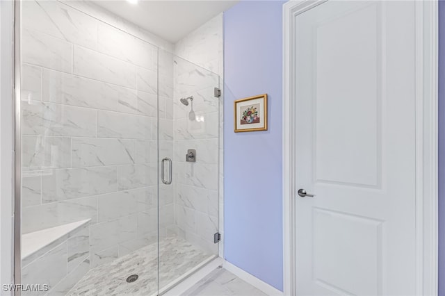 4705 Arboretum Cir Unit 202, Naples, FL 34112 - bathroom with marble look tile flooring and a shower stall