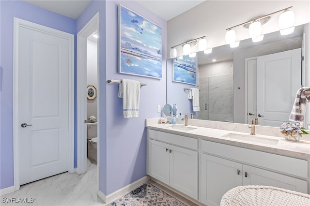 bathroom with vanity, toilet, and an enclosed shower