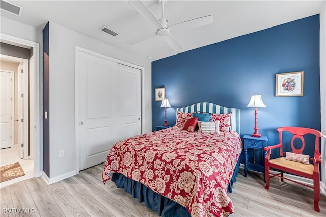 4705 Arboretum Cir Unit 202, Naples, FL 34112 - bedroom featuring light wood finished floors, a closet, and ceiling fan