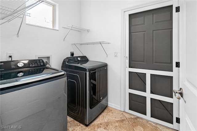 laundry room featuring washing machine and clothes dryer