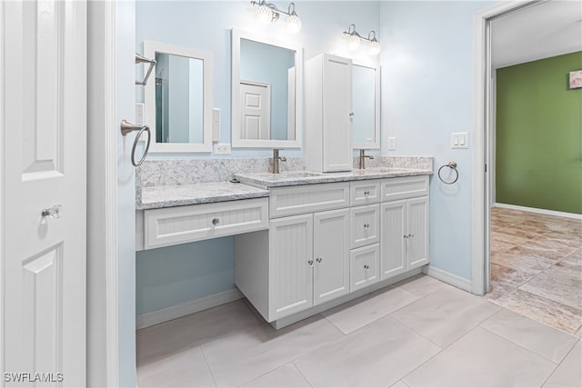 bathroom with tile patterned flooring and vanity