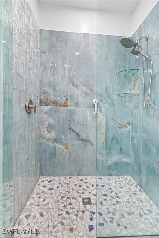 bathroom with a tile shower