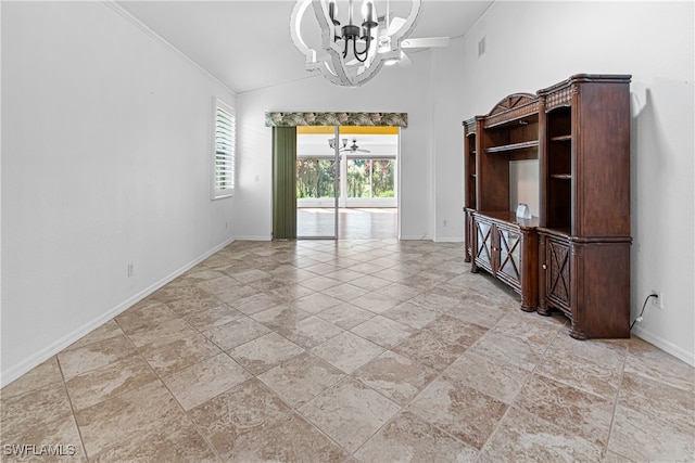 spare room with ornamental molding, lofted ceiling, and an inviting chandelier