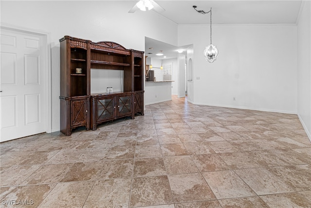 unfurnished living room featuring ceiling fan with notable chandelier