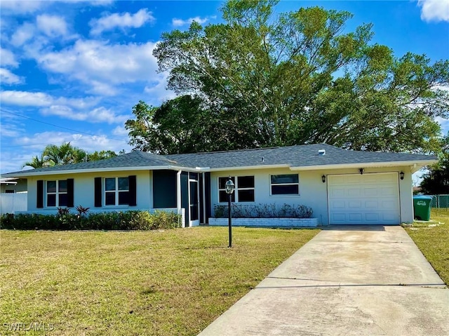 single story home featuring an attached garage, a front lawn, concrete driveway, and stucco siding