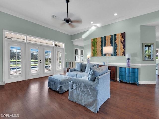 living room with french doors, dark hardwood / wood-style flooring, ceiling fan, and crown molding