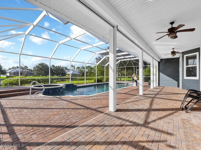 view of swimming pool with an in ground hot tub, a patio area, ceiling fan, and a lanai