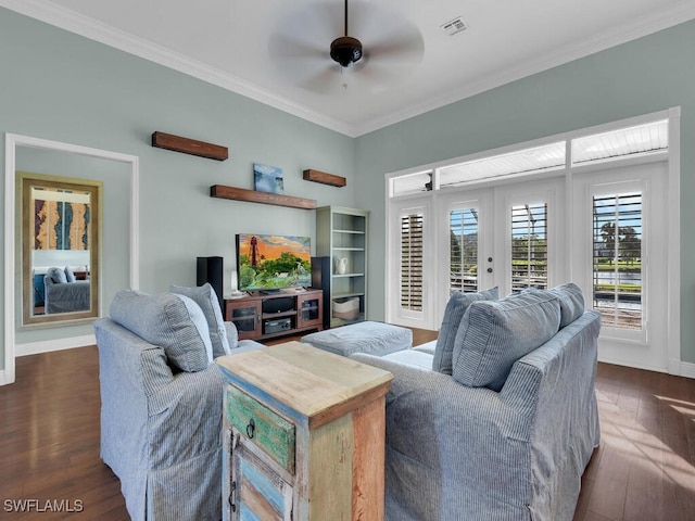 living room featuring ceiling fan, crown molding, and dark wood-type flooring