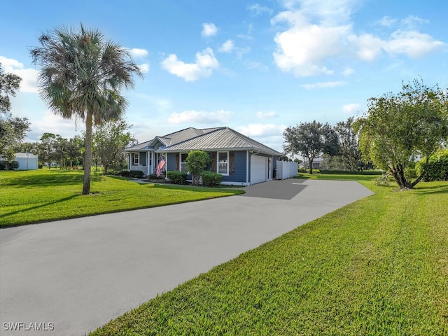 ranch-style home featuring a garage and a front lawn