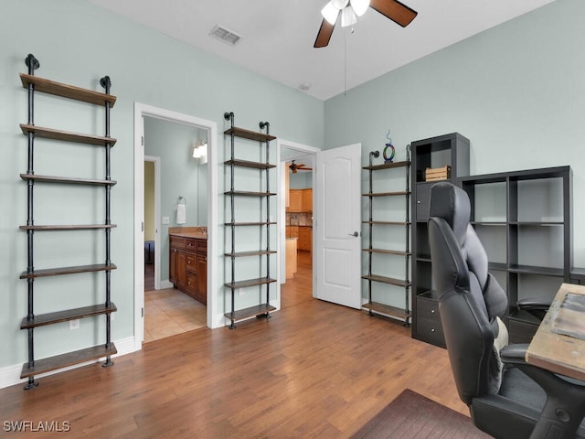 office featuring ceiling fan and light hardwood / wood-style flooring