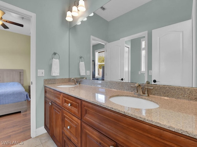 bathroom featuring hardwood / wood-style floors, vanity, and ceiling fan