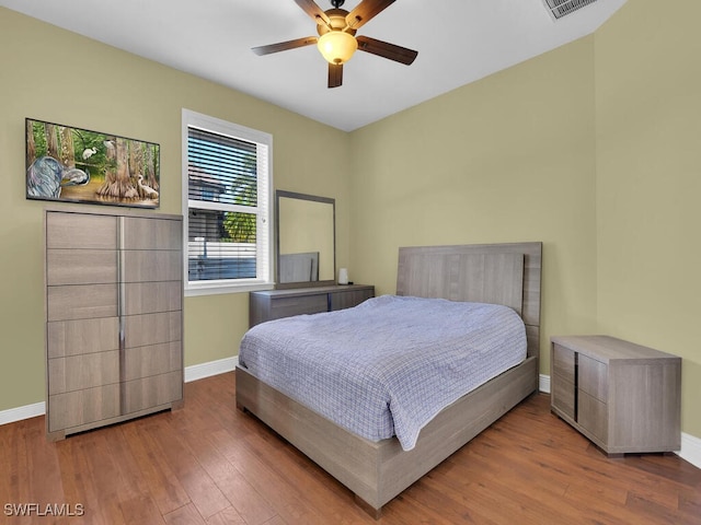 bedroom featuring ceiling fan and wood-type flooring