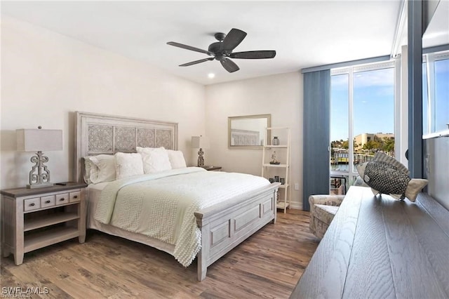 bedroom featuring dark wood-type flooring and ceiling fan