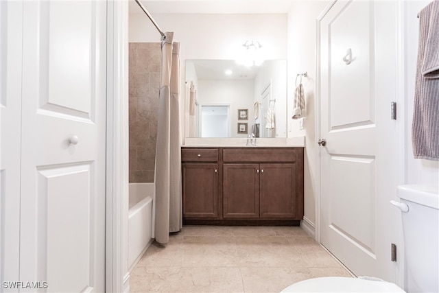 full bathroom with toilet, vanity, and shower / bath combination with curtain