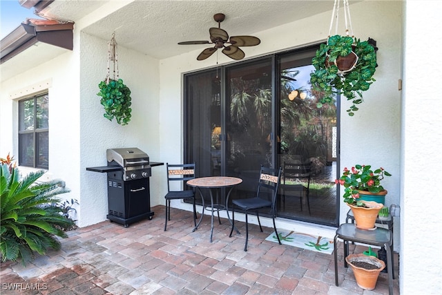 view of patio / terrace with grilling area and ceiling fan