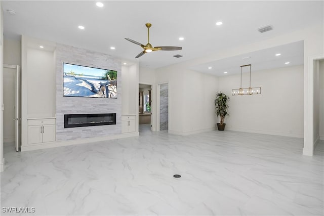 unfurnished living room featuring a fireplace and ceiling fan