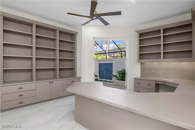 unfurnished office featuring ceiling fan