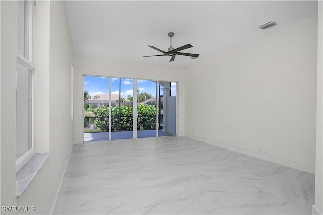 unfurnished room with ceiling fan