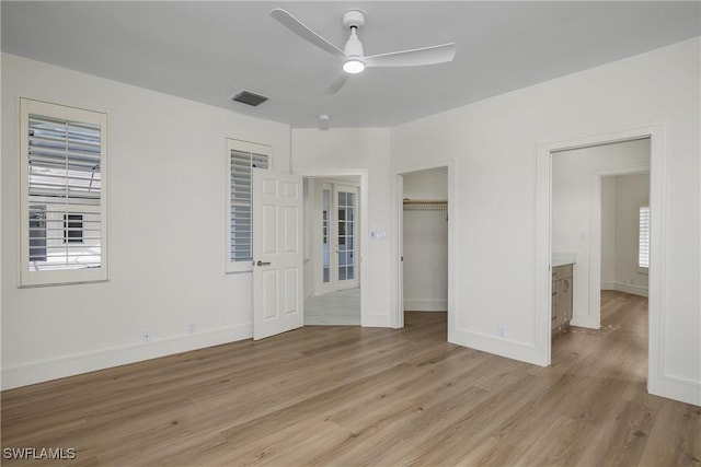 unfurnished bedroom with light wood-type flooring and ceiling fan