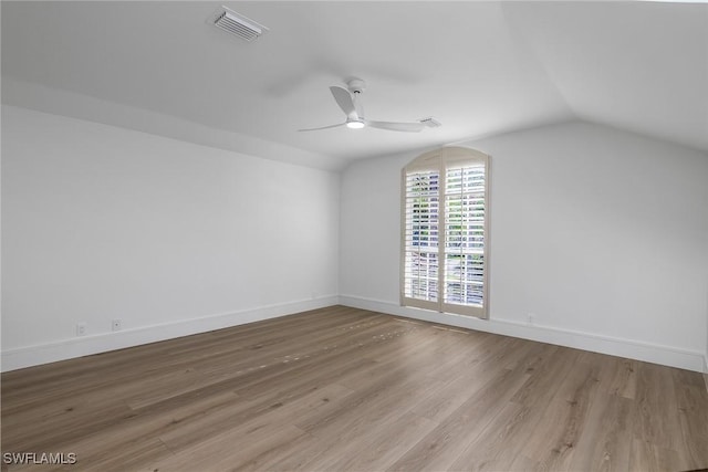 bonus room with ceiling fan, lofted ceiling, and light wood-type flooring