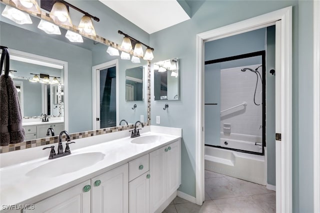 bathroom featuring vanity, tile patterned floors, and bath / shower combo with glass door