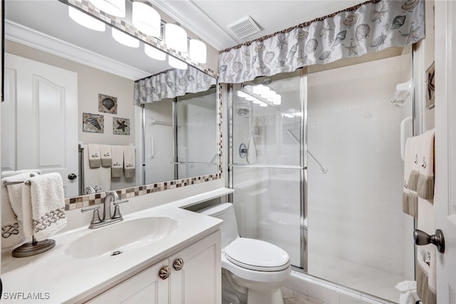 bathroom featuring toilet, ornamental molding, vanity, and a shower with door