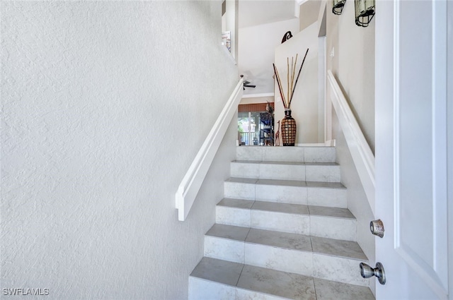 staircase with tile patterned flooring