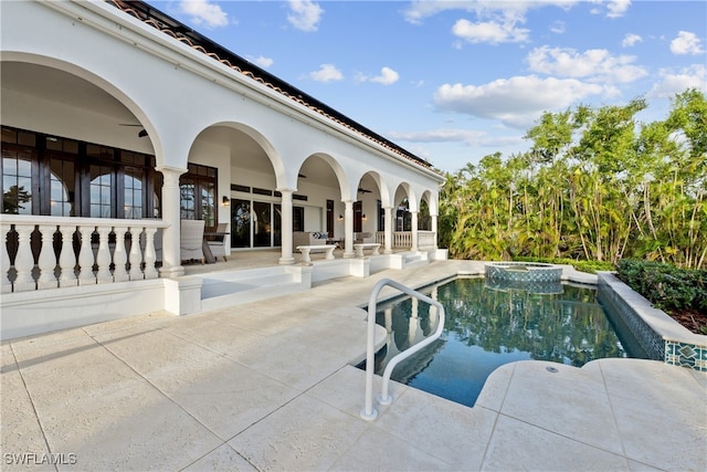 view of swimming pool with an in ground hot tub and a patio area