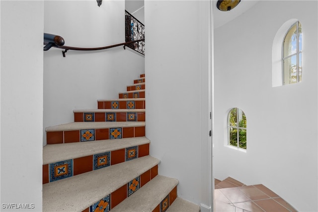 stairs with tile patterned flooring