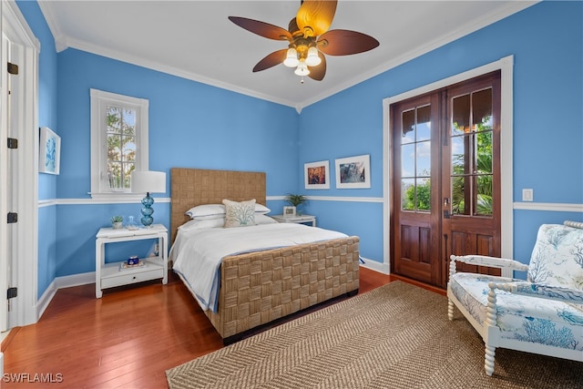 bedroom featuring ceiling fan, crown molding, and dark hardwood / wood-style flooring