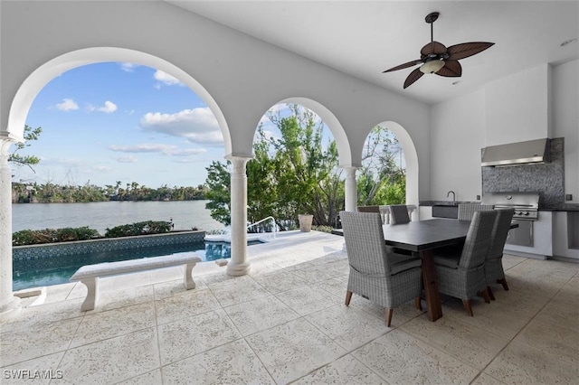 view of patio / terrace featuring a grill, a water view, and ceiling fan