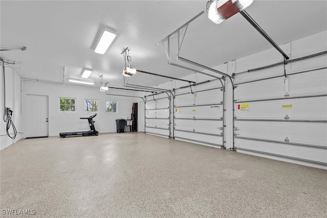 garage featuring a garage door opener