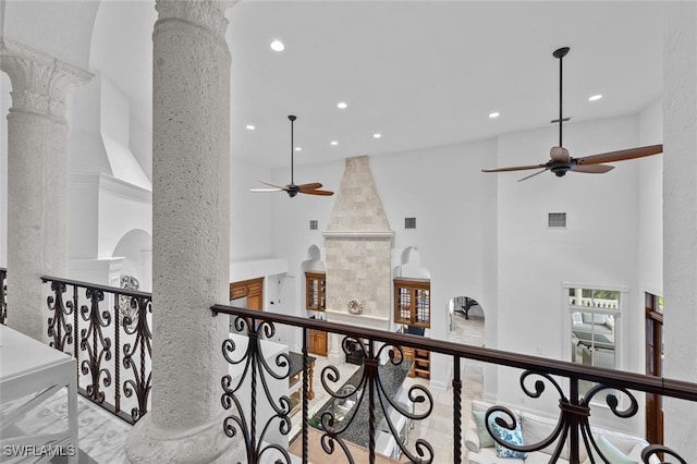 hall with a towering ceiling and decorative columns