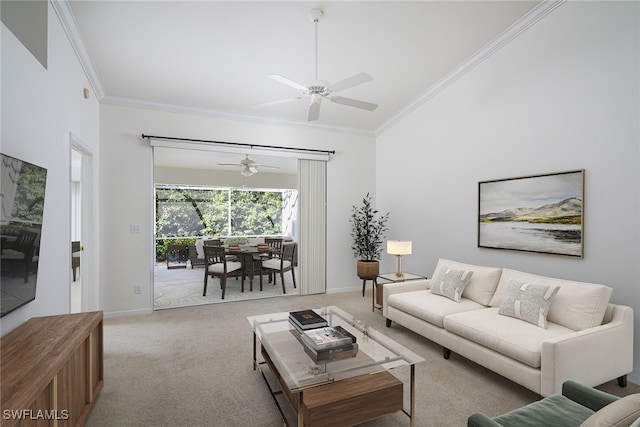 living room featuring ceiling fan, light colored carpet, and ornamental molding