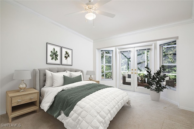 carpeted bedroom with access to exterior, french doors, ornamental molding, and ceiling fan