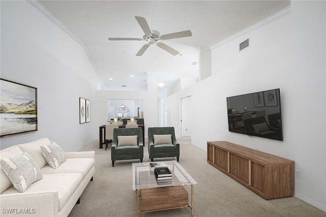 carpeted living room with high vaulted ceiling, ceiling fan, and ornamental molding