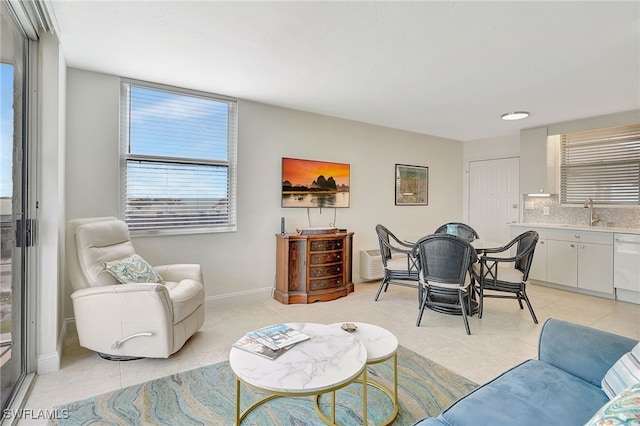 living room with sink and light tile patterned floors