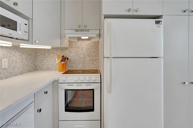 kitchen featuring white cabinetry, light stone countertops, backsplash, and white appliances