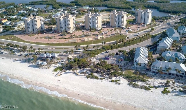 aerial view featuring a water view and a beach view